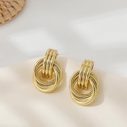 Freja – Eleganta flätade guldörhängen med statement-design